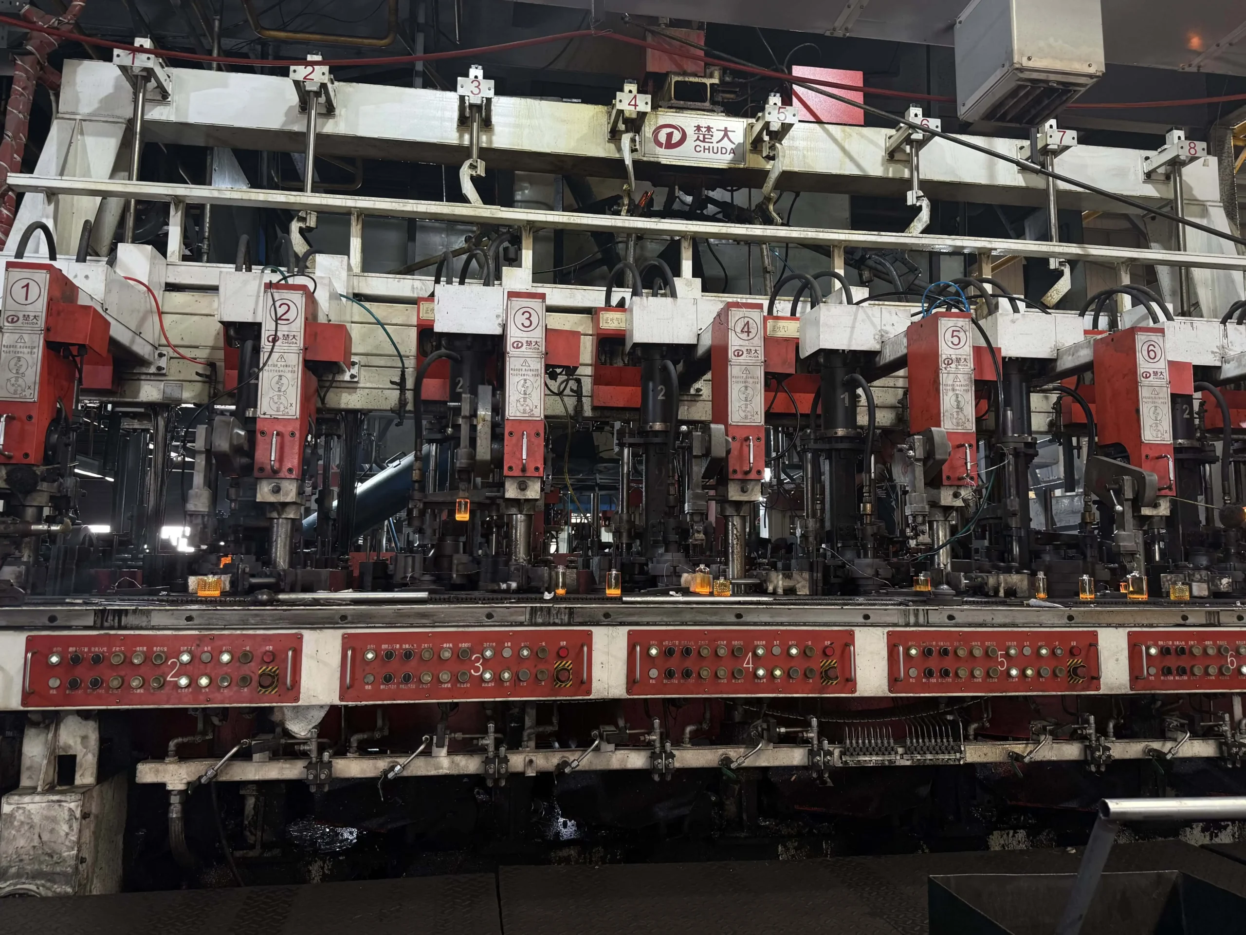 Automatic glass bottle blowing and pressing production line