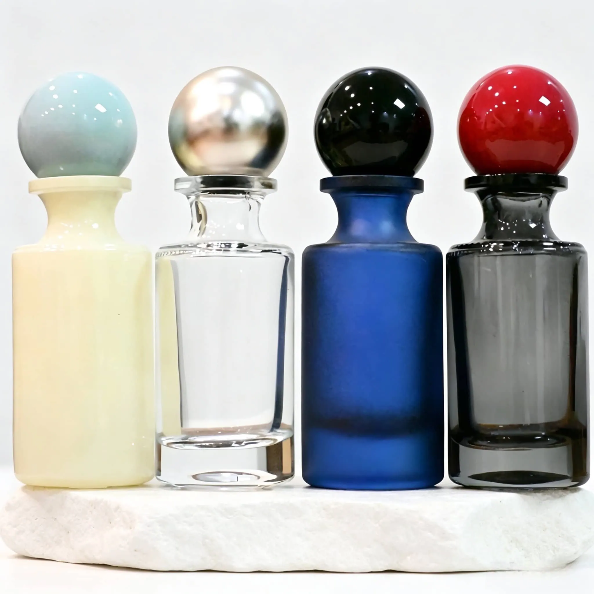 Color spraying on glass perfume bottles