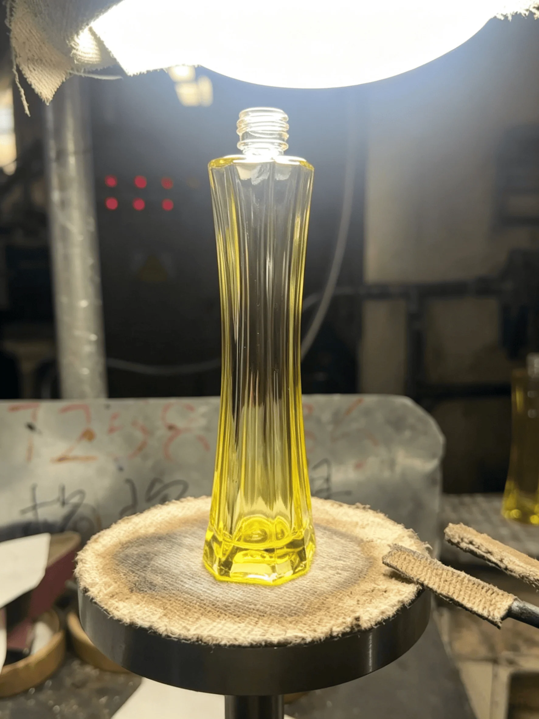 Tapered waist glass bottle -- hourglass silhouette mold