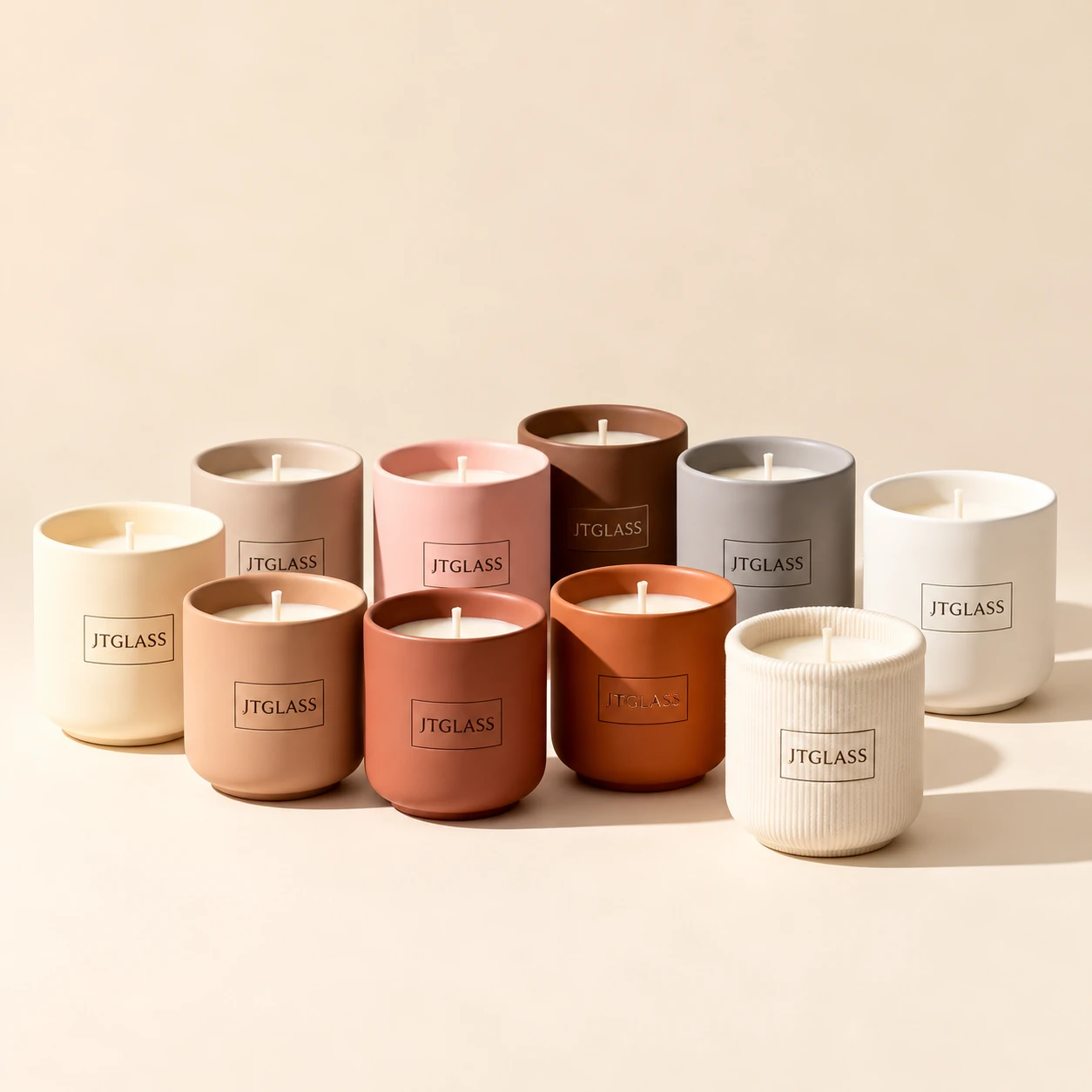 Scented candles in colored glass jars